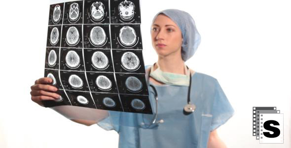 Female Surgeon Reviewing Mri