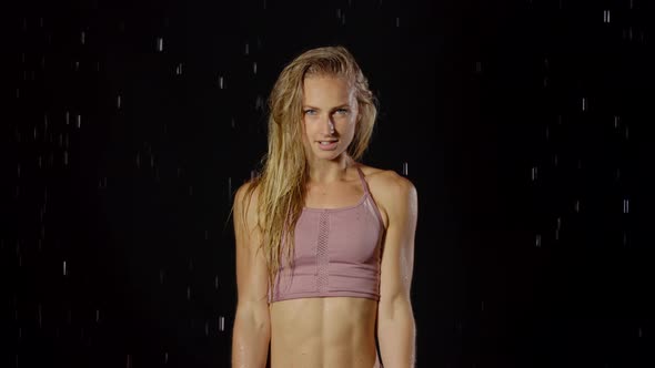 Athletic Blond Woman Working Out In The Rain