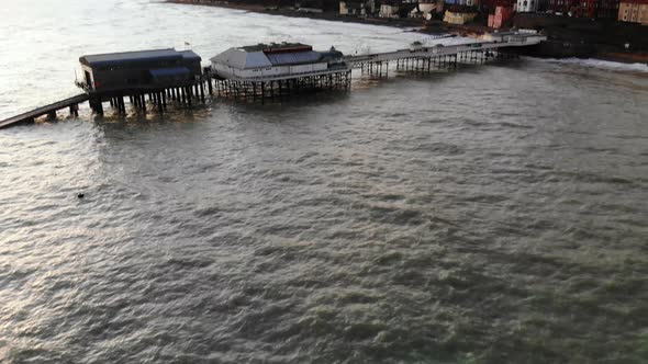 Aerial footage of cromer pier and town shot from the sea.