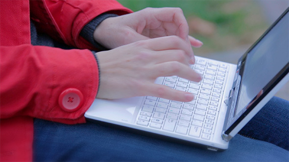 Student Works on the Laptop Outdoor