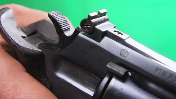 Man Hand Reloads Revolver alt