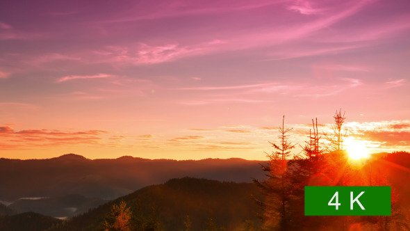 Sunrise over the Forested Mountains alt