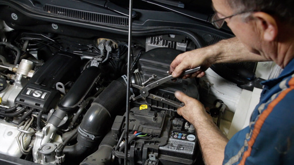 Car Repair Mechanic Assembling Auto Air Filter