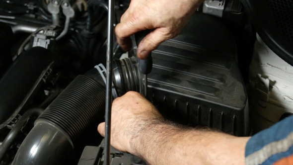 Car Repair Mechanic Screwing Automobile Air Filter