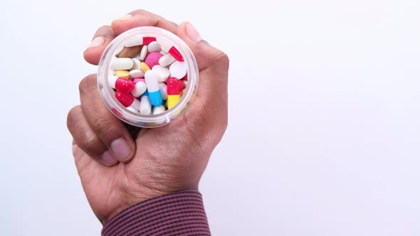 Top View of Man Holding Pill Container 