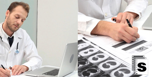 Doctor Using Laptop And Mobile Phone 2 (Male)