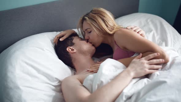 Sensual Couple Embracing in Bed