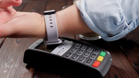 Customer Using Smart Watch to Pay