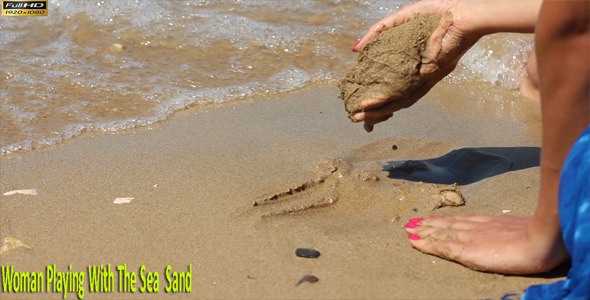 Woman Playing With The Sea Sand