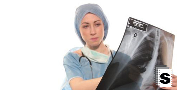 Female Surgeon Reviewing X-ray