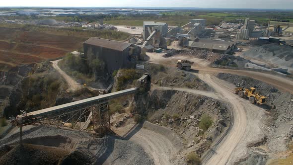 A Huge Dump Truck Taking Ore to a Refinery in a Quarry