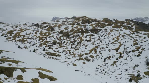 Aerial, Beautiful Winter Landscape In Mountains And Skiers On Ski Tracks In Dolomites In Italy