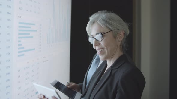 Investors with Documents and Tablet