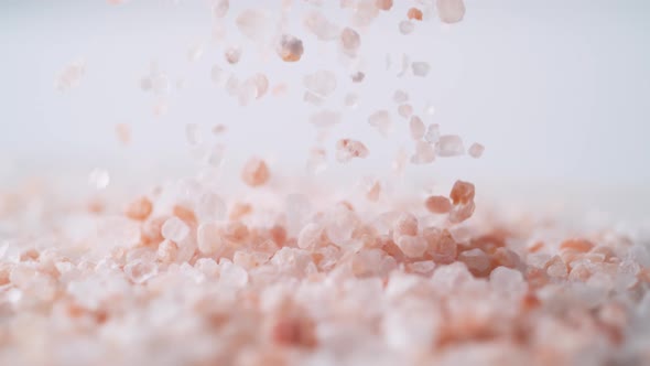 Himalayan rock salt falling. Slow Motion.