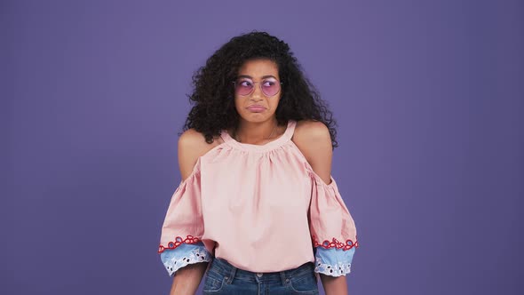 Ethnic Black Girl in Sunglasses Colorful Blouse and Jeans