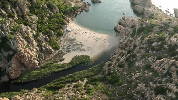 exotic small sandy beach between mountains , Sardinia island, Italy