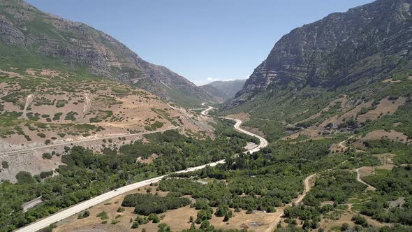 Aerial view of road winding through canyon