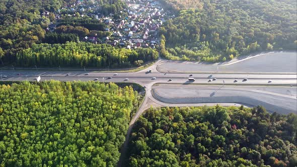 Video From a Drone View of the Road Bridge Over the River in the City