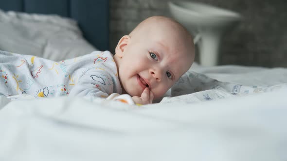 portrait of a baby in bed