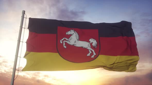 Lower Saxony flag, Germany, waving in the wind, sky and sun background
