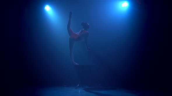 Gymnast Performs Tricks on the Table in the Studio