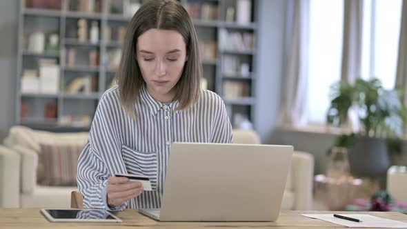 Young Woman Making Successful Online Payment on Laptop