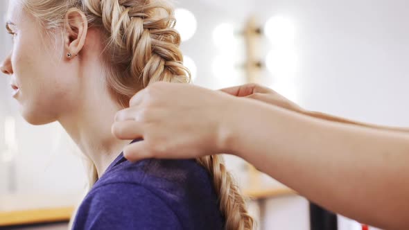 Female Hairdresser Making Haircut to Blonde Girl in Beauty Salon Slow Motion