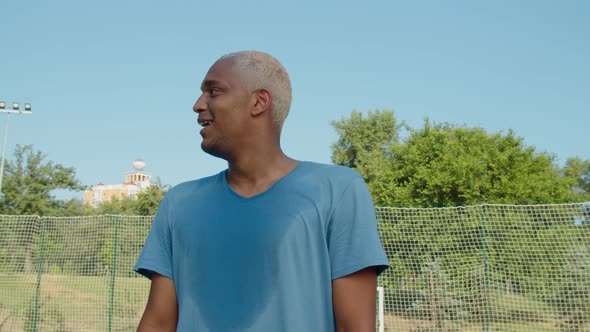 Portrait of Handsome Young Adult Black Male Sportsman Outdoors