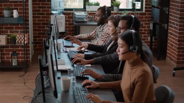 Office Workers Working at Call Center Office to Help People