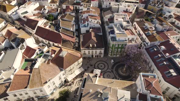 Overhead aerial top down view traditional square with narrow streets in Lagos, Algarve