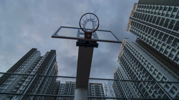 Basketball backboard during sunset hour.