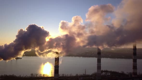 Smoke From Factory Chimneys on Background of Sunset Sky 008