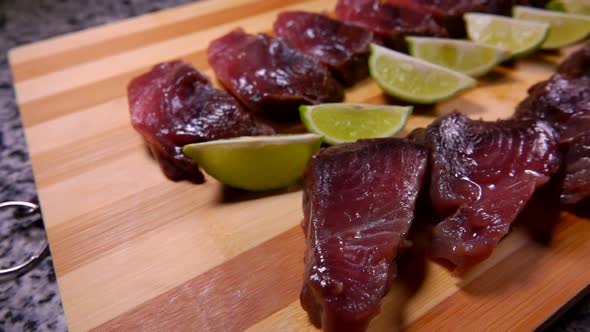 Panorama of Raw Tuna Fish Steaks Laying on the Wooden Board