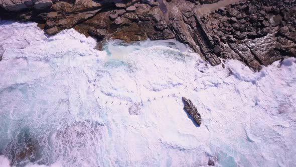 Strong blue waves in ocean crashing on the shore. Maroubra Beach, Sydney. Beautiful drone view on cl