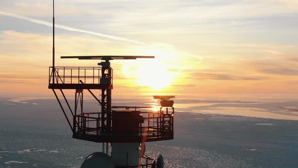 Upper Ground of Communication Tower Illuminated By Sunset