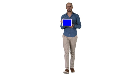 Arab man walking and showing tablet presenting something