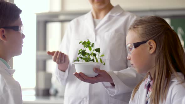 Students and Teacher with Plant at Biology Class 19