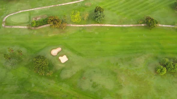 4K Aerial view Top-down view of Lawn Golf course in the morning or evening light, beautiful green