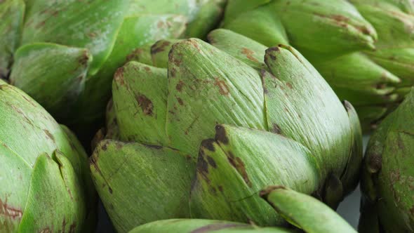 Whole Fresh Artichokes on Plate