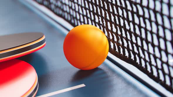 The camera is tilting up a table tennis ball. Ping pong ball, paddles and net.