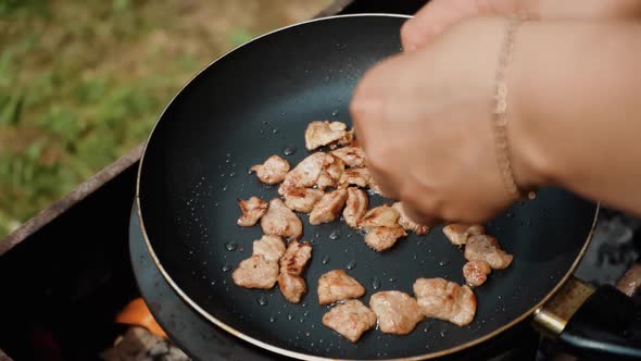 Closeup of Broken Egg Falls Into the Frying Pan