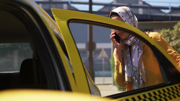 Young woman wearing hijab out and about in the city