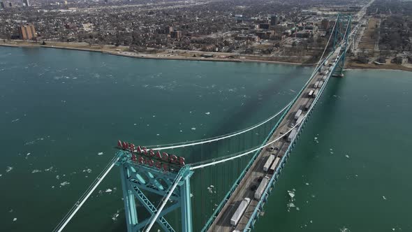 Semi-trucks pilling on Ambassador bridge to cross USA - Canada border. Aerial view