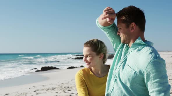 Couple in love enjoying free time on the beach together