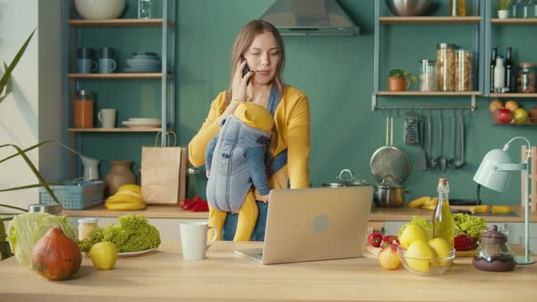 Mother Working From Home With Baby