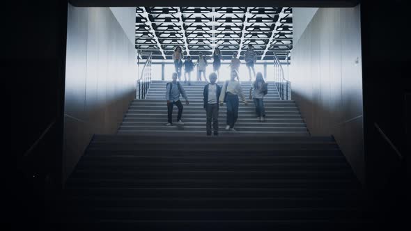 Schoolchildren Running Downstairs Passing Sad Boy