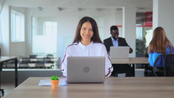 Young Manager Waving Hand in Open Space Office Worker in Start Up Company