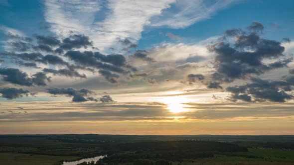 Beautiful Dramatic Fast Lapse Time of Sunset and Clouds in the Blue Orange Sky