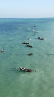 Vertical Video Boats in the Ocean Near the Coast of Zanzibar Tanzania