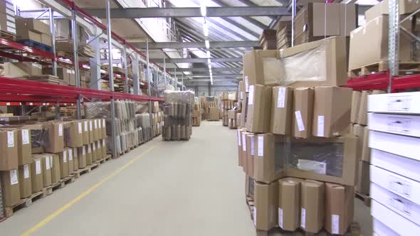 Large Commercial Warehouse with Boxes and Shelves